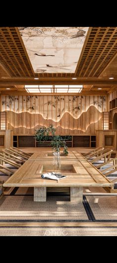 a large wooden table sitting inside of a room filled with lots of tables and chairs