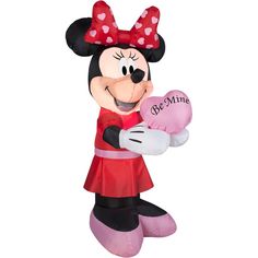 the minnie mouse balloon is holding a heart