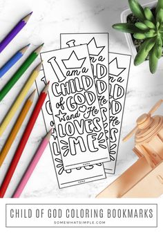 a coloring bookmark with the words child of god surrounded by crayons and colored pencils