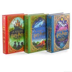 three harry potter books lined up in front of each other on a white background,