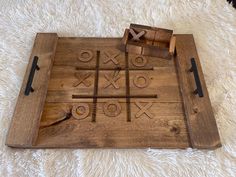 a tic - tac - toe board on a white carpet