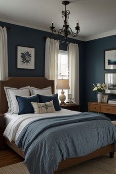 a bedroom with blue walls and white curtains