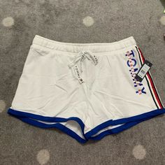 Brand New With Tags, Good Condition, Never Worn, Women Size Medium Tommy Hilfiger Summer Bottoms With Pockets, Casual Tommy Hilfiger Short Bottoms, Tommy Hilfiger Shorts With Pockets, Tommy Hilfiger Blue Short-length Bottoms, Tommy Hilfiger Cotton T-shirt With Text Print, Tommy Hilfiger Shorts, Tommy Hilfiger, Womens Sizes, Womens Shorts