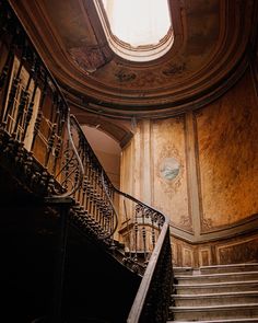 an old building with some stairs and a skylight