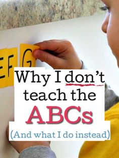 a young boy is holding a sign that says, why i don't teach the abcs and what i do instead