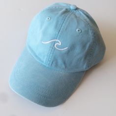 The perfect embroidered baseball cap with a simple wave design. One size fits all, cap has a leather adjustment strap in the back.  Color may differ slightly from photo. Baseball Hats For Women, Baseball Sunglasses, Cleveland Indians Baseball, Baseball Helmet, Mad Hat, Hats Baseball Caps, Scheduling Software, Trendy Hat, Embroidered Baseball