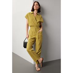 Green linen (100% Linen). Jumpsuit. Cap sleeves. Collared. Front button closure. 17" from shoulder to hemline. 27" inseam. 14" rise. Imported. Green Linen Casual Jumpsuits And Rompers, Casual Green Linen Jumpsuits And Rompers, Chic Linen Jumpsuits And Rompers With Short Sleeves, Summer Workwear Jumpsuits And Rompers With Pockets, Linen Jumpsuits And Rompers With Pockets For Work, Relaxed Fit Linen Short-sleeved Jumpsuit, Relaxed Fit Linen Jumpsuit With Short Sleeves, Relaxed Fit Linen Jumpsuits And Rompers With Short Sleeves, Summer Workwear Jumpsuits With Short Sleeves