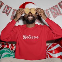 "Believe" embroidered Christmas sweater for men. A sturdy and warm sweatshirt bound to keep you warm in the colder months. A pre-shrunk, classic fit sweater that's made with air-jet spun yarn for a soft feel. * 50% cotton, 50% polyester * Pre-shrunk * Classic fit * 1x1 athletic rib knit collar with spandex * Air-jet spun yarn with a soft feel * Double-needle stitched collar, shoulders, armholes, cuffs, and hem This product is made especially for you as soon as you place an order, which is why it Embroidered Christmas Sweater, Believe Christmas, Christmas Sweater Men, Mens Hoodies, Christmas Jumper, Sweatshirt For Men, Christmas Men, Mens Sweatshirts Hoodie, Fitted Sweater