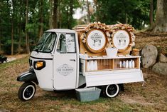 an ice cream truck is parked in the woods