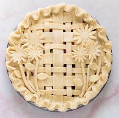 an uncooked pie sitting on top of a table