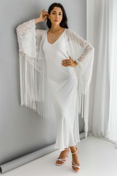 "Ivory off white tassel kimono, pure silk bridal shrug cover up.  CLEO is our ivory pure silk embroidered fringe trim kimono, perfect as a bridal cover up. * Semi sheer ivory pure silk georgette    * Made to Order approx 3-5 weeks * Custom sizes available please enquire info@bibiluxestudio.com SIZES  SMALL Fits Hips / Bust to up to 38\" FITS UK sizes 6-10-12 / Euro 34-38 / US 4-8  Actual garment measurements bust / hips 44\" (  when measuring for fit add an extra 6-8\" above your body measuremen Kimono Over Dress, Nude Slip Dress, Bridal Shrug, Bridal Cover Up, White Kimono, Embroidered Kimono, Fringe Kimono, Custom Gown, Body Measurement