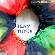 the words team tutus written on a white board in front of multicolored tulle skirts