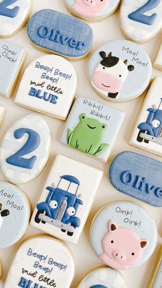 decorated cookies with farm animals and numbers on them