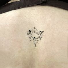 the back of a woman's stomach with two people on it