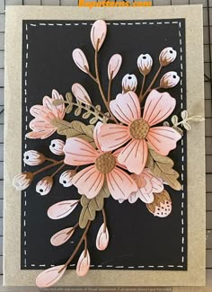 a close up of a card with pink flowers on black and white paper, along with the words happy birthday written in gold