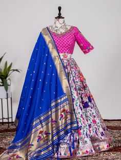 Bollywood Replica LehengaA jacquard Rani Pink chaniya with jacquard blouse and a beautiful blue paithani dupatta giving all your special occasions!  *Lehenga(Stitched)*Lehenga Fabric : Jacquard Silk(Paithani)Lehenga work : Weaving Zari Work Waist : SUPPORTED UP TO 42Length : 41Flair : 3.50 MeterStitching : Stitched With Canvas and Can Can Lehenga Closer : Drawstring with Handmade TasselsInner : Micro Cotton *Blouse(Unstitched)*Blouse Fabric : Mono BangloryBlouse Work : S Wedding Lehenga With Unstitched Blouse In Paithani Silk, Embroidered Paithani Silk Choli In Traditional Drape, Embroidered Paithani Silk Choli With Traditional Drape, Traditional Embroidered Paithani Silk Choli, Fitted Paithani Silk Lehenga With Zari Work, Fitted Paithani Silk Lehenga With Traditional Drape, Fitted Paithani Silk Lehenga In Traditional Drape, Multicolor Raw Silk Choli With Meenakari, Embroidered Paithani Silk Choli For Festive Season