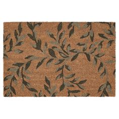 a door mat with leaves on it