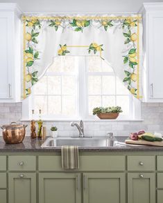 a kitchen window with lemons on the valance