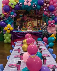 the table is set up for a birthday party