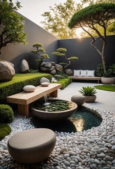 an outdoor garden with rocks and water features trees, shrubs, and benches in the center