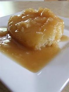 a piece of cake on a plate with caramel sauce