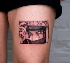 a woman's thigh with an anime character tattoo on it