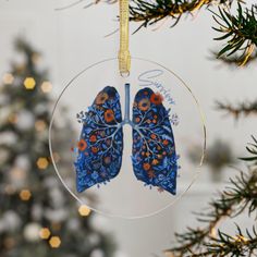 a glass ornament hanging from a christmas tree