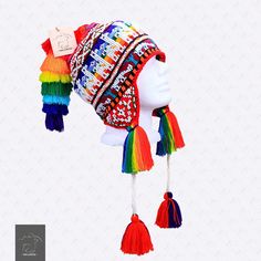 "FREE SHIPPING This colorful Chullo is a handmade hat made by indigenous from the Andes in Pisac Cusco - PERU, woven in multicolored wool yarn, with ear flaps and decorated with beads all around, which are sewn one by one. This particular one has a design of the \"Andean Llama\",South American camelid from the Andean cultures. If laid flat, the Chullo alone is approximately 12\" long x 10.5\" wide. Including the pompoms on the bottom and all of the top, it measures from end to end 30\" approxima Traditional Multicolor Hat One Size Fits Most, Traditional Festival Hat One Size, Multicolor Woven Festival Hat, Bohemian Multicolor Woven Hat, Bohemian Multicolor One-size Hats, Multicolor Bohemian Beanie Hat, Colorful Handmade Hats For Festivals, Bohemian Multicolor Beanie, Multicolor Bohemian Beanie