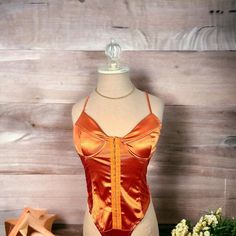 Metallic Bold Orange Bodysuit , Cheeky Bottom Orange Fitted One-piece Bodysuit, Fitted Orange One-piece Bodysuit, Fitted Orange Bodysuit With Lined Body, Heart Bodysuit, Purple Bodysuit, Orange Bodysuit, Bodysuit Tops, Womens Camo, Velvet Bodysuit