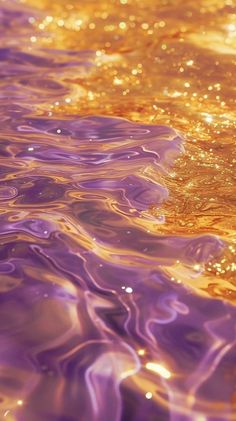 the water is reflecting light on it's surface and gold flecks are visible