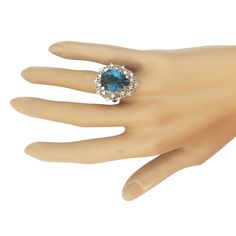 Stamped: 14K White GoldTotal Ring Weight: 8.3 GramsRing Length: N/ARing Width: N/AGemstone Weight: Total Natural Topaz Weight is 8.19 Carat (Measures: 15.85x11.90 mm)Color: London BlueDiamond Weight: Total Natural Diamond Weight is 0.65 CaratColor: F-G, Clarity: VS2-SI1Face Measures: 26.10x22.14 mmSku: [703416W] Formal Topaz Gemstone Ring, Exquisite Formal Topaz Ring, Formal Multi-stone Topaz Ring With Round Cut, Formal Topaz Crystal Ring With Gemstone, Formal Crystal Ring With Center Topaz Stone, Formal Blue Topaz Crystal Ring With Accent Stones, Fine Jewelry Collectible Topaz Ring With Center Stone, Formal Topaz Crystal Ring, Formal Topaz Crystal Ring With Prong Setting