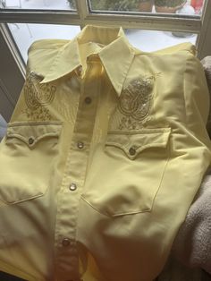 Vintage 1970s Western Cowboy Yellow Snap Buttons Shirt  Size Medium 15 1/2 X 32  with Long Tail.  See pics for measurements  Awesome Details   Snap button up front  and sleeves and pockets.  Embroidered Horseshoes Design  Quality old vintage brand  - H Bar C California Ranchwear  Permanent Press  Pictures do not do this justice.  Much more appreciated in person.  Medium bright yellow seen better in the pictures near the windows  Excellent condition.  Appears to have been worn very little if at a