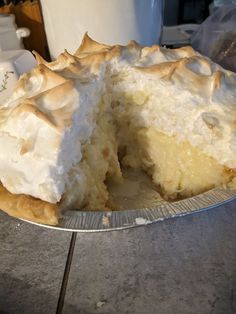 a cake that has been cut in half and is on a table next to a cup