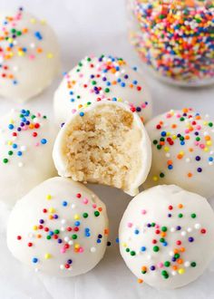 white cake truffles with sprinkles on them