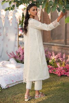 Brand: Cross StitchProduct Code: 0124RTSPRTLWN0225Collection: Cross Stitch Eid Lawn Unstitched Spring Summer CollectionFabric: Lawn DESIGN DETAILS: SHIRT Printed shirt (Lawn) 2 embroidered motifs for shirt 40" embroidered patti for sleeves TROUSER Cambric dyed trouser DUPATTA Chiffon printed dupatta ATTRIBUTE Upgrade your wardrobe with the WHISPERING WHITE 3-piece embroidered lawn suit. Featuring a printed shirt and two embroidered motifs, along with 40 embroidered patti for sleeves, this suit is both stylish and elegant. Complete the look with a cambric-dyed trouser and a chiffon-printed dupatta. Perfect for any occasion. DISCLAIMER:* Lining, Laces, and Tassels are not included in unstitched variants.* Embellishment items in stitched outfits are subject to market availability.* The actual Green Dupatta, Lawn Design, Formal Wear Women, Embroidered Motifs, Printed Dupatta, Kurti Collection, Luxury Wear, Lawn Suits, Holiday Trends