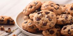 a plate full of chocolate chip cookies on a table