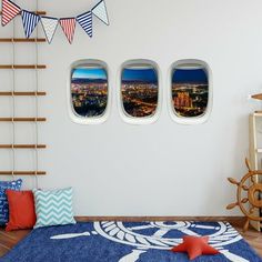 an airplane window with the city seen through it's portholes in this room