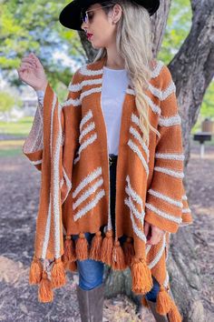 Caramel Western Textured Pattern With Chunky Tassel Cardigan AMOLI Brown Knitted One Size Cardigan, Brown Knitted One-size Cardigan, One Size Brown Knitted Cardigan, Bohemian Brown Knit Outerwear, One Size Tassel Cardigan For Fall, Knitted Brown Poncho For Fall, Brown One Size Bohemian Sweater, Bohemian Brown One Size Sweater, Brown Knit Poncho For Fall