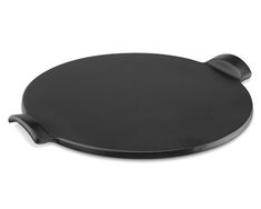 an empty black plate on a white background