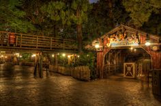 the entrance to an amusement park at night