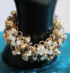 "This is a fabulous bracelet with a mix of clear rhinestones, opaque white glass beads and faceted topaz crystals on a gold tone link chain. It measures 7-1/2\" long and it is 1-1/2\" wide. Gold bar magnetic clasp. Excellent vintage condition." Gold Beaded Party Chain Bracelet, Gold Crystal Bracelet With Faceted Details, Beaded Chain Bracelet With Round Beads For Party, Party Chain Bracelet With Round Beads, Gold Round Beads Crystal Bracelet For Party, Gold Crystal Bracelet With Round Beads For Party, Gold Jeweled Crystal Bracelet For Party, Gold Charm Bracelet With Round Beads For Party, Gold Crystal Bracelet With Gold Beads For Party