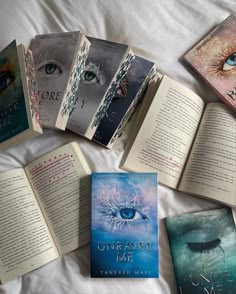 there are many books on the bed with each one open to show an eyeball