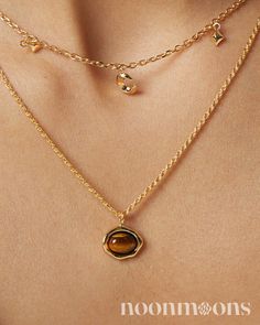 Elegance Meets Healing: Dainty Gold-Plated Tiger's Eye Charm Choker Necklace ☽ Embrace subtle sophistication with this s925 sterling silver gold-plated choker necklace, featuring a delicate tiger's eye charm stone. The charm is beautifully bezel-set and adds a touch of natural allure to the dainty charm necklace. This charm necklace pendant not only enhances your style but also serves as a healing necklace, believed to bring strength and balance. As the November birthstone, tiger's eye adds a meaningful touch, making it a perfect gift or personal keepsake. Whether you're dressing up for a special occasion or adding a chic touch to everyday wear, this charm necklace chain offers a blend of elegance and personal significance. ♥︎  DETAILS: ☽ Material: 18k Gold-plated S925 Sterling Silver, Tig Dainty Everyday Charm Necklaces, Silver Gold Plated Necklace, Luxury Minimalist Gold Plated Charm Necklace, Cheap Yellow Gold Clavicle Chain Charm Necklace, Luxury Minimalist Yellow Gold Charm Necklace, Gold Gemstone Chain Necklace Fine Jewelry, Gold Gemstone Round Chain Necklace, Gold Gemstone Chain Necklace, Gold Chain Necklace With Round Gemstone