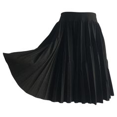 Alaïa black wool base pleated volumed circle skirt with high-rise waist. Double pleated design, very calculated contrasting silhouette. With Zip fastening at the back. Made in Italy. Size tag : 38 FR 80% wool, Polyamide 10%, viscose 5% and nylon 5% Measurements: Length : 51 cm Waist : 79 cm Volume Skirt, Black Cotton Skirt, Azzedine Alaïa, Informal Dress, Zipper Skirt, Jersey Skirt, Sheer Skirt, Layered Skirt, Plaid Skirt