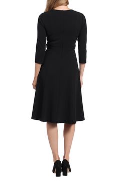 Button tab waist details add a flatteringly chic touch to this midi length dress. 44.25" length (size 2) Crew neck 3/4 sleeves Back zip closure Button tab waist Seamed detail Midi length Model stats: 5'10" height, 32" bust, 25" waist, 36" hip. Model is wearing size 2. Midi Length Dress, Midi Length, Nordstrom Rack, Dresses For Work, Size 2, Midi Dress, Nordstrom, Crew Neck, London