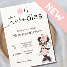 a minnie mouse birthday party card on a plate