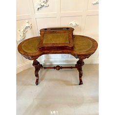 an old wooden table with two trays on it