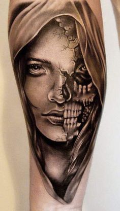 a woman's leg with a tattoo on it and a skull in the middle