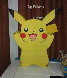 a paper cut out of a pikachu sitting on top of a table