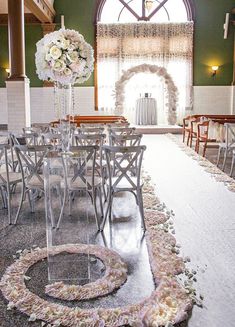 the wedding venue is decorated with white flowers and greenery